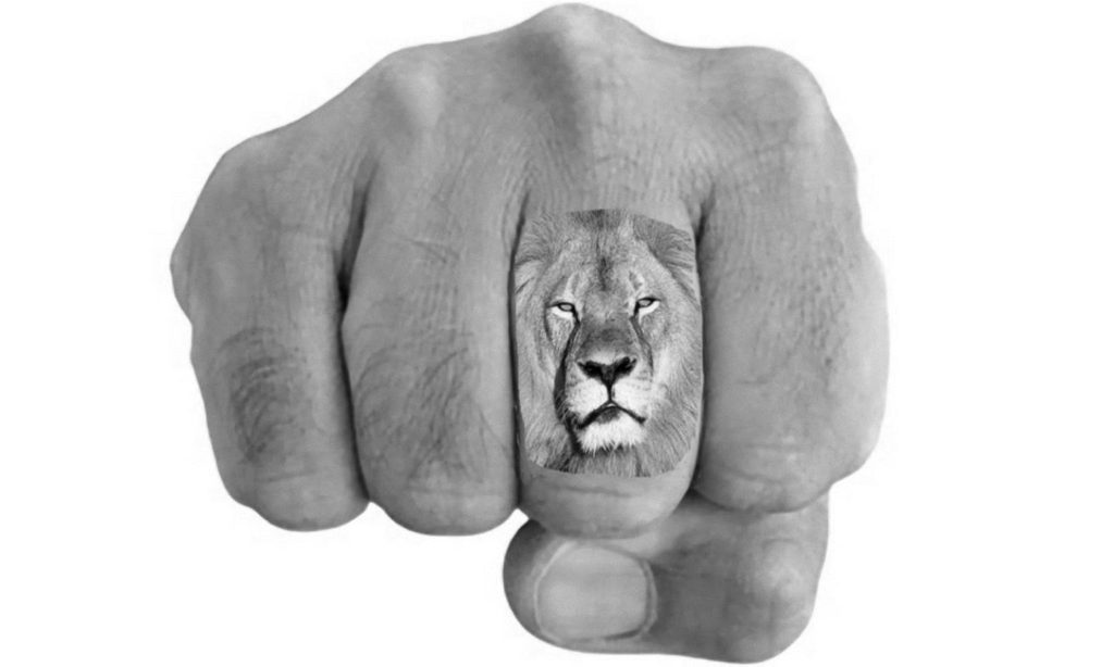Lion on Finger Tattoo
